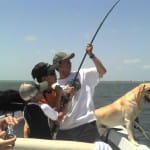Four men fighting a big shark!